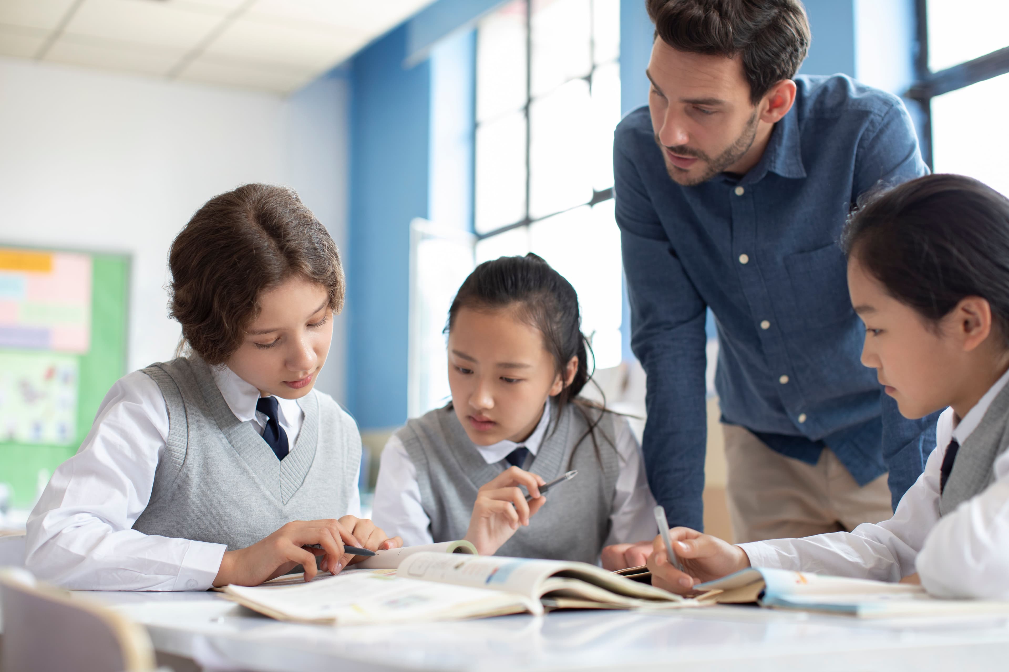Male teacher with students